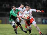 27 January 2010; Tommy McGuigan, Tyrone, in action against Barry Mulrone, Fermanagh. Barrett Sports Lighting Dr. McKenna Cup Semi-Final, Tyrone v Fermanagh, Healy Park, Omagh, Co. Tyrone. Picture credit: Oliver McVeigh / SPORTSFILE