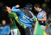 27 January 2010; Dublin manager Pat Gilroy, centre, tries to seperate his player Colin Daly, right, from Meath's James Macken during the game. O'Byrne Cup Quarter-Final replay, Meath v Dublin, Pairc Tailteann, Navan, Co. Meath. Photo by Sportsfile