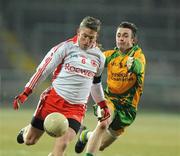 30 January 2010; Dermot Carlin, Tyrone, in action against David Walsh, Donegal. Barrett Sports Lighting Dr. McKenna Cup Final, Donegal v Tyrone, Brewster Park, Enniskillen, Co. Fermanagh. Picture credit: Oliver McVeigh / SPORTSFILE
