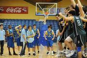 30 January 2010; Dejected UCD players look on as the trophy is being presented to Maree, Galway. Men’s Under-20 National Cup Final, UCD Marian, Dublin v Maree, Galway, National Basketball Arena, Tallaght, Dublin. Photo by Sportsfile