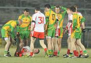 30 January 2010; Stephen O'Neill, Tyrone, lies on the ground after obtaining a suspected broken elbow. Barrett Sports Lighting Dr. McKenna Cup Final, Donegal v Tyrone, Brewster Park, Enniskillen, Co. Fermanagh. Picture credit: Oliver McVeigh / SPORTSFILE