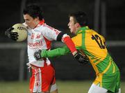 30 January 2010; Matthew Donnelly, Tyrone, in action Eoin Wade, Donegal. Barrett Sports Lighting Dr. McKenna Cup Final, Donegal v Tyrone, Brewster Park, Enniskillen, Co. Fermanagh. Picture credit: Oliver McVeigh / SPORTSFILE