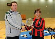 30 January 2010; Ger Dunne, FAI , presents the Plate trophy to Trinity captain Megan Capper. WSCAI National Futsal Plate Final, Trinity v NUIM, Kingfishers Sports Centre, NUIG, University Road, Galway. Picture credit: Matt Browne / SPORTSFILE