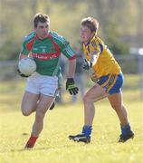 31 January 2010; Seamus O Se, Mayo, in action against Cathal McHugh, Roscommon. Connacht FBD League, Section A, Round 3, Roscommon v Mayo, Ballinlough GAA Grounds, Ballinclough, Co. Roscommon. Picture credit: Ray Ryan / SPORTSFILE