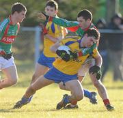 31 January 2010; Stephen Ormsby, Roscommon, in action against Mark Ronaldson, Mayo. Connacht FBD League, Section A, Round 3, Roscommon v Mayo, Ballinlough GAA Grounds, Ballinclough, Co. Roscommon. Picture credit: Ray Ryan / SPORTSFILE