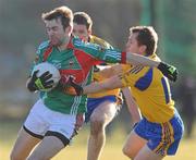 31 January 2010; Ronan McGarrity, Mayo, in action against Gary Cox, Roscommon. Connacht FBD League, Section A, Round 3, Roscommon v Mayo, Ballinlough GAA Grounds, Ballinclough, Co. Roscommon. Picture credit: Ray Ryan / SPORTSFILE