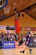 31 January 2010; Jermaine Turner, Killester, goes for a dunk watched by Niall O'Reilly, UCC Demons. Men's Superleague National Cup Final 2010, Killester v UCC Demons, National Basketball Arena, Tallaght, Dublin. Picture credit: Brendan Moran / SPORTSFILE