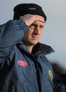 31 January 2010; Offaly manager Joe Dooley keeps an eye on the action. Walsh Cup Quarter-Final, Offaly v Kilkenny, O'Connor Park, Tullamore, Co. Offaly. Picture credit: Brian Lawless / SPORTSFILE