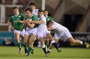 26 February 2016; Conor O'Brien, Ireland, is tackled by George Perkins, England. U20 Six Nations Rugby Championship, England v Ireland,  Kingston Park, Newcastle, England. Picture credit: Ramsey Cardy / SPORTSFILE