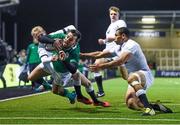 26 February 2016; Matthew Byrne, Ireland, dives over to scores his side's second try of the game, despite the efforts of Matthew Protheroe, left, and Joe Marchant, England. U20 Six Nations Rugby Championship, England v Ireland,  Kingston Park, Newcastle, England. Picture credit: Ramsey Cardy / SPORTSFILE