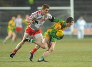 30 January 2010; Leo McLoone, Donegal, in action Niall McKenna, Tyrone. Barrett Sports Lighting Dr. McKenna Cup Final, Donegal v Tyrone, Brewster Park, Enniskillen, Co. Fermanagh. Picture credit: Oliver McVeigh / SPORTSFILE