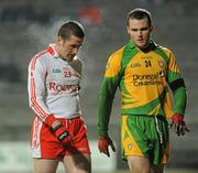 30 January 2010; Stephen O'Neill, Tyrone, being marked by Neil McGee, Donegal. Barrett Sports Lighting Dr. McKenna Cup Final, Donegal v Tyrone, Brewster Park, Enniskillen, Co. Fermanagh. Picture credit: Oliver McVeigh / SPORTSFILE