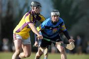 31 January 2010; Rob O'Loughlin, UCD, in action against PJ Nolan, Wexford. Walsh Cup Quarter-Final, Wexford v UCD, Pairc Ui Siochan, Gorey, Co. Wexford. Picture credit: Daire Brennan / SPORTSFILE