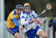 31 January 2010; Maurice Shanahan, Waterford in action against Pat Donnellan, Clare. Munster GAA Waterford Crystal Hurling Cup Semi-Final, Waterford v Clare, Ballyduff GAA Grounds, Ballyduff Upper, Waterford. Picture credit: Matt Browne / SPORTSFILE *** Local Caption ***