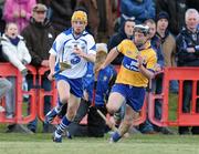 31 January 2010; Thomas Ryan, Waterford in action against Alan Brigdale, Clare. Munster GAA Waterford Crystal Hurling Cup Semi-Final, Waterford v Clare, Ballyduff GAA Grounds, Ballyduff Upper, Waterford. Picture credit: Matt Browne / SPORTSFILE *** Local Caption ***