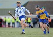 31 January 2010; Maurice Shanahan, Waterford in action against Pat Donnellan, Clare. Munster GAA Waterford Crystal Hurling Cup Semi-Final, Waterford v Clare, Ballyduff GAA Grounds, Ballyduff Upper, Waterford. Picture credit: Matt Browne / SPORTSFILE *** Local Caption ***