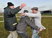 3 February 2010; Joint Owner Basil Holian, right, celebrates with Kevin Connolly, left, and Jack Buckley, catcher, after Adios Alonso won the Boylesports.com Derby. 85th National Coursing Meeting - Wednesday, Powerstown Park, Clonmel, Co. Tipperary. Picture credit: Brian Lawless / SPORTSFILE