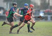 4 February 2010; Shane Burke, UCC, in action against Nicky O'Connell and James McInerney, LIT. Ulster Bank Fitzgibbon Cup Round 1, University College Cork v Limerick Institute of Technology, Mardyke, Cork. Picture credit: Matt Browne / SPORTSFILE