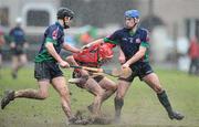 4 February 2010; Shane Burke, UCC, is tackled Nicky O'Connel, left, and James McInerney, LIT. Ulster Bank Fitzgibbon Cup Round 1, University College Cork v Limerick Institute of Technology, Mardyke, Cork. Picture credit: Matt Browne / SPORTSFILE