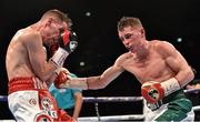 27 February 2016; Ryan Burnett, right, exchanges punches with Anthony Setteoul. Manchester Arena, Manchester, England.  Picture credit: Ramsey Cardy / SPORTSFILE