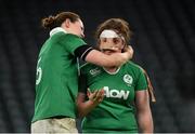 27 February 2016; Ailis Egan has her protective strapping removed by her Ireland team-mate Marie Louise Reilly after the game. Women's Six Nations Rugby Championship, England v Ireland. Twickenham Stadium, Twickenham, London, England. Picture credit: Stephen McCarthy / SPORTSFILE
