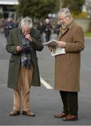 28 February 2016; Two punters study their racecards before the start of the days racing. Leopardstown, Co. Dublin. Photo by Sportsfile