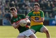 28 February 2016; Shane Nally, Mayo, in action against Martin McElhinney, Donegal. Allianz Football League, Division 1, Round 3, Donegal v Mayo, MacCumhaill Park, Ballybofey, Co. Donegal. Picture credit: Oliver McVeigh / SPORTSFILE