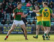 28 February 2016; Diarmuid O'Connor, Mayo, celebrates in front of Anthony Thompson, Donegal, after scoring a goal from a penalty. Allianz Football League, Division 1, Round 3, Donegal v Mayo, MacCumhaill Park, Ballybofey, Co. Donegal. Picture credit: Oliver McVeigh / SPORTSFILE