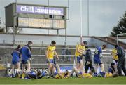 28 February 2016; The Roscommon team stretch after the game as the final score is displayed on the scoreboard. Allianz Football League, Division 1, Round 3, Cork v Roscommon. Páirc Uí Rinn, Cork. Picture credit: Diarmuid Greene / SPORTSFILE