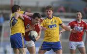 28 February 2016; Jamie O'Sullivan, Cork, in action against Conor Devaney, left, and Cathal McHugh, Roscommon. Allianz Football League, Division 1, Round 3, Cork v Roscommon. Páirc Uí Rinn, Cork. Picture credit: Diarmuid Greene / SPORTSFILE