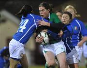5 February 2010; Nora Stapleton, Ireland, in action against Veronese, left, and Schiavon Valentina, Italy. Women's Six Nations Rugby Championship, Ireland v Italy, Ashbourne RFC, Ashbourne, Co. Meath. Picture credit: Barry Cregg / SPORTSFILE