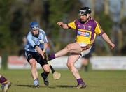 6 February 2010; Barry Kenny, Wexford, gets his kick away, despite the attention of Kevin Flynn, Dublin. Walsh Cup Semi-Final, Wexford v Dublin, Pairc Ui Siochan, Gorey, Co. Wexford. Picture credit: Daire Brennan / SPORTSFILE