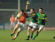 6 February 2010; Charlie Vernon, Armagh, in action against Chris O'Connor and Mark Ward, right, Meath. Allianz GAA Football National League, Division 2, Round 1, Meath v Armagh, Pairc Tailteann, Navan, Co. Meath. Picture credit: Pat Murphy / SPORTSFILE