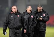 6 February 2010; A worried looking Tyrone Manager, Mickey Harte, centre, along with Fergal McCann, Trainer, left, and Tony Donnelly, Assistant Manager, comes off at half time. Allianz GAA Football National League, Division 1, Round 1, Derry v Tyrone, Celtic Park, Derry. Picture credit: Oliver McVeigh / SPORTSFILE