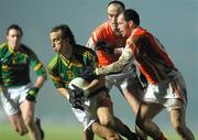 6 February 2010; Anthony Moyles, Meath, in action against Malachy Mackin and Ciaran McKeever, right, Armagh. Allianz GAA Football National League, Division 2, Round 1, Meath v Armagh, Pairc Tailteann, Navan, Co. Meath. Picture credit: Pat Murphy / SPORTSFILE