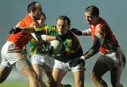 6 February 2010; Anthony Moyles, Meath, in action against Malachy Mackin and Ciaran McKeever, right, Armagh. Allianz GAA Football National League, Division 2, Round 1, Meath v Armagh, Pairc Tailteann, Navan, Co. Meath. Picture credit: Pat Murphy / SPORTSFILE