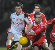 6 February 2010; Enda McGinley, Tyrone, in action against Brian Og McAlary, Derry.. Allianz GAA Football National League, Division 1, Round 1, Derry v Tyrone, Celtic Park, Derry. Picture credit: Oliver McVeigh / SPORTSFILE