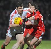 6 February 2010; Enda McGinley, Tyrone, in action against Dermot McBride, Derry. Allianz GAA Football National League, Division 1, Round 1, Derry v Tyrone, Celtic Park, Derry. Picture credit: Oliver McVeigh / SPORTSFILE