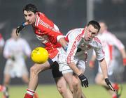 6 February 2010; Liam Hinphey, Derry, in action against Kyle Coney, Tyrone. Allianz GAA Football National League, Division 1, Round 1, Derry v Tyrone, Celtic Park, Derry. Picture credit: Oliver McVeigh / SPORTSFILE