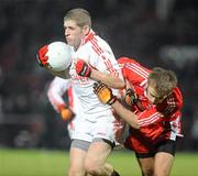 6 February 2010; Kevin Hughes, Tyrone, in action against Brian Og McAlary, Derry. Allianz GAA Football National League, Division 1, Round 1, Derry v Tyrone, Celtic Park, Derry. Picture credit: Oliver McVeigh / SPORTSFILE