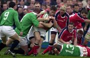 13 April 2001; Tom Tierney of Munster is tackled by Gary Longwell of Rest of Ireland during the Friendly match between Munster and Rest of Ireland at Thomond Park in Limerick. Photo by Brendan Moran/Sportsfile