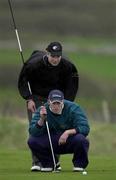 14 April 2001; Mark Murphy of Waterville GC assisted by his caddie Andy Daly, lines up a putt on the 7th green during the West of Ireland Open Golf Championship at Sligo Golf Club in Rosses Point in Sligo. Photo by Brendan Moran/Sportsfile