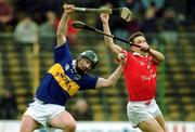 15 April 2001; David Kennedy of Tipperary in action against Alan Browne of Cork during the Allianz GAA National Hurling League Division 1B Round 5 match between Tipperary and Cork at Semple Stadium in Thurles, Tipperary. Photo by Damien Eagers/Sportsfile