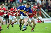15 April 2001; Noel Morris of Tipperary in action against Seánie McGrath of Cork during the Allianz GAA National Hurling League Division 1B Round 5 match between Tipperary and Cork at Semple Stadium in Thurles, Tipperary. Photo by Damien Eagers/Sportsfile
