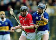 15 April 2001; Pat Mulcahy of Cork in action against John Leahy of Tipperary during the Allianz GAA National Hurling League Division 1B Round 5 match between Tipperary and Cork at Semple Stadium in Thurles, Tipperary. Photo by Damien Eagers/Sportsfile