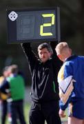 15 April 2001; A Wicklow substitute checks the amount of added time displayed on the board by the fourth official Joe Kelly during the Leinster Senior Hurling Championship First Preliminary Round match between Wicklow and Kildare at Pearse Park in Arklow, Wicklow. Photo by Ray McManus/Sportsfile