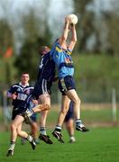 11 April 2001; David Hannify of UCD in action against Kevin Hughes of UUJ during the Sigerson Cup Final match between UCD and UUJ at Scotstown GAA in Monaghan. Photo by Damien Eagers/Sportsfile