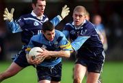 11 April 2001; Joe Fallon of UCD in action against Kevin Hughes of UUJ, right, during the Sigerson Cup Final match between UCD and UUJ at Scotstown GAA in Monaghan. Photo by Damien Eagers/Sportsfile
