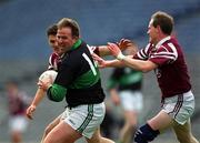 16 April 2001; Colin Corkery of Nemo Rangers gets away from Tom Nallen, right, and Stephen Rochford of Crossmolina during the AIB All-Ireland Senior Club Football Championship Final match between Crossmolina and Nemo Rangers at Croke Park in Dublin. Photo by Ray McManus/Sportsfile
