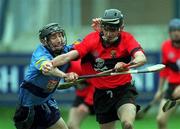 6 April 2001; Colin Morrissey of UCC is tackled by Redmond Barry of UCD during the Fitzgibbon Cup Final match between UCD and UCC at Parnell Park in Dublin. Photo by Damien Eagers/Sportsfile